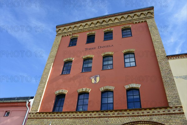 View of a historic red brick building with the nameplate 'Torres Daniela' under a blue sky, Torre Daniela, Werder, Island, Havel, Brandenburg