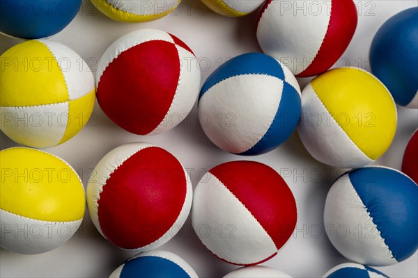 Colourful juggling balls, white behind, as background, studio shot, Germany, Europe