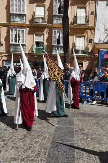 Semana Santa, procession with Nazarenos and tourists, celebrations in Cadiz, Spain, Europe