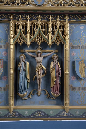 Interior of the priory church at Edington, Wiltshire, England, UK, altar reredos detail Christ on the Cross