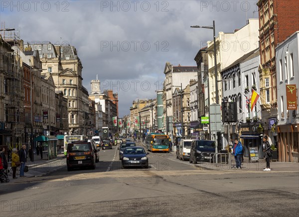 Traffic and people in busy St Mary Street, city centre of Cardiff, South Wales, UK