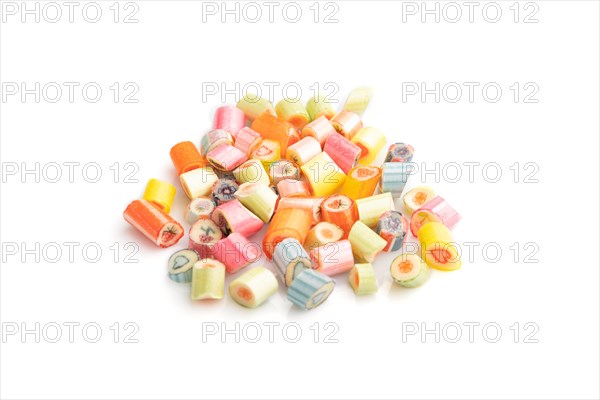 Heap of multicolored caramel candies isolated on white background. close up, side view