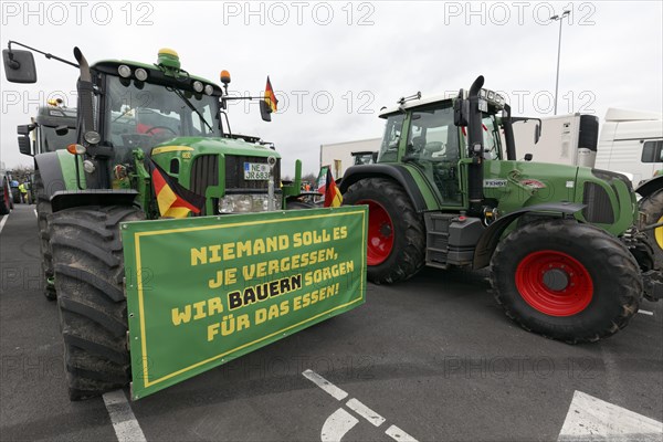 Tractor with sign, Farmers provide food, Farmers' protests, Demonstration against policies of the traffic light government, Abolition of agricultural diesel subsidies, Duesseldorf, North Rhine-Westphalia, Germany, Europe