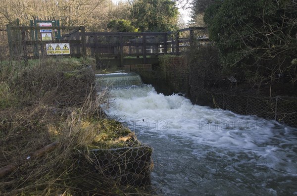 Whitebridge weir on the River Deben, Campsea Ashe, Suffolk England is a simple mechanical device to regulate river flow between the seasons