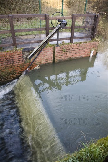 Whitebridge weir on the River Deben, Campsea Ashe, Suffolk England is a simple mechanical device to regulate river flow between the seasons