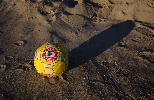 Capped football, leather ball, FC Bayern Munich logo, FCB, air is out, symbolic image, symbolic, Perea, Peraia Beach, Thessaloniki, Macedonia, Greece, Europe