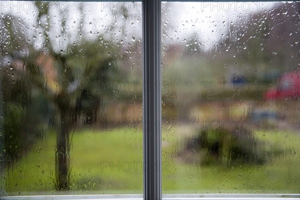 Rain drops on window on wet day