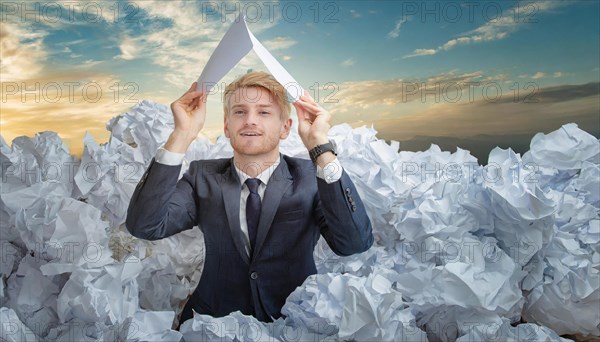 A man in a suit holds a paper aeroplane over a sea of crumpled papers, symbol bureaucracy, AI generated, AI generated