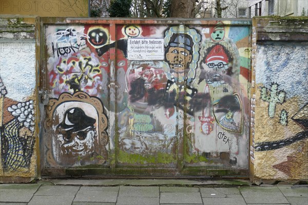 Colourfully painted gate to a driveway, Bremen, Germany, Europe