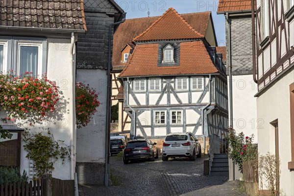 Old schoolhouse, half-timbered house with mansard roof, cultural monument, listed building, old town, Ortenberg, Vogelsberg, Wetterau, Hesse, Germany, Europe