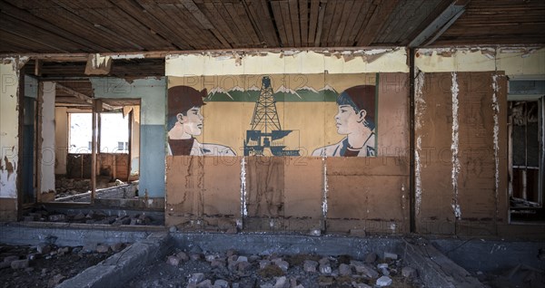 Abandoned building, ruins of an old school from the USSR Ghost town Enilchek in the Tien Shan Mountains, Ak-Su, Kyrgyzstan, Asia