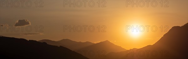 Sunset over a mountain peak, panoramic shot, view from the lowlands, Leoben, Styria, Austria, Europe