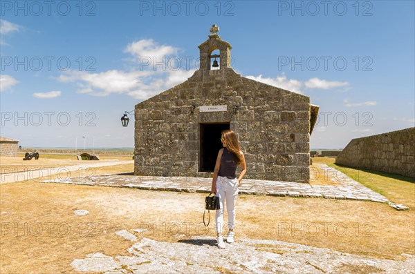 Female tourist visiting Forte de Santa Tereza in Uruguay, an important tourist site