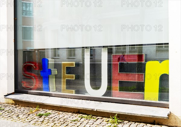 Advertising on the shop window of a tax office, Berlin, Germany, Europe