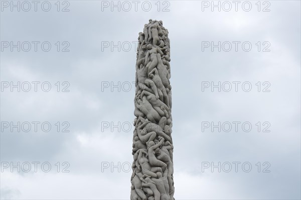 A stone pillar with intertwined bodies in Frogner Park, Pillar of Life, art, Oslo, Norway, Europe