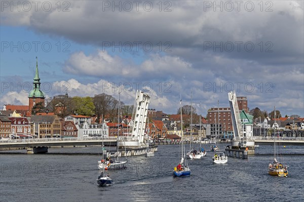 Sailing boats pass through open bascule bridge, Kappeln, Schlei, Schleswig-Holstein, Germany, Europe