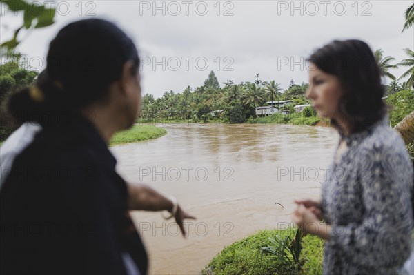 (R-L) Christine Fung, employee of the Deutsche Gesellschaft fuer Internationale Zusammenarbeit, and Annalena Baerbock (Buendnis 90/Die Gruenen), Federal Foreign Minister, photographed during a visit to the village of Vuniniudrovo, 6 May 2024. Baerbock is travelling to Australia, New Zealand and Fiji for political talks / Photographed on behalf of the Federal Foreign Office