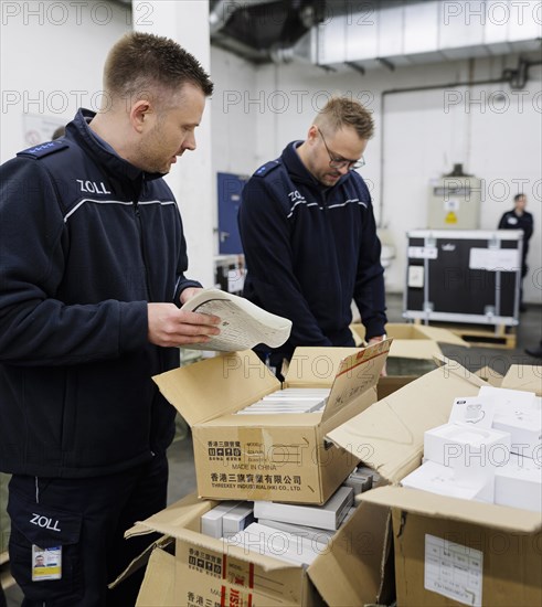 Customs officers check a load of an aircraft that has landed in the cargo area at the airport, Frankfurt am Main, 03/05/2024