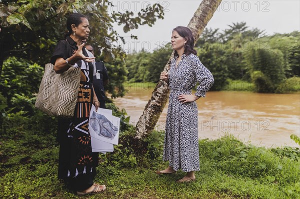 (R-L) Annalena Baerbock (Buendnis 90/Die Gruenen), Federal Foreign Minister, and Christine Fung, employee of the Deutsche Gesellschaft fuer Internationale Zusammenarbeit, photographed during a visit to the village of Vuniniudrovo, 6 May 2024. Baerbock is travelling to Australia, New Zealand and Fiji for political talks / Photographed on behalf of the Federal Foreign Office