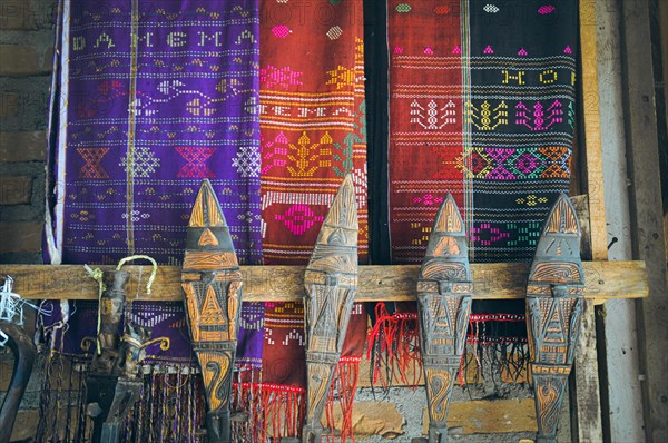 Colorful Ulos fabrics showcasing indigenous ethnic design and intricate patterns of the Batak people of North Sumatra Indonesia, on display for sale in the local market