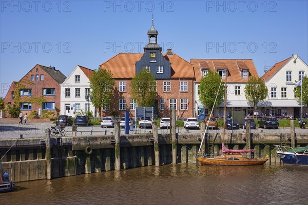 Skipper's house and harbour basin with boats in Toenning harbour, Nordfriesland district, Schleswig-Holstein, Germany, Europe