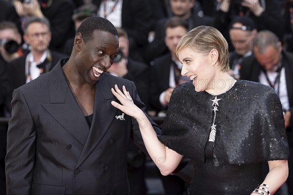 Cannes, France, 16.5.2024: Omar Sy and Greta Gerwig at the premiere of Megalopolis on the red carpet of the Palais des Festivals during the 77th Cannes International Film Festival. The 77th Cannes International Film Festival will take place from 14 to 25 May 2024, Europe