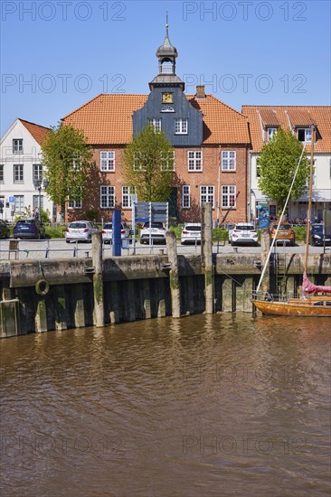 Skipper's house and harbour basin with boats in Toenning harbour, Nordfriesland district, Schleswig-Holstein, Germany, Europe