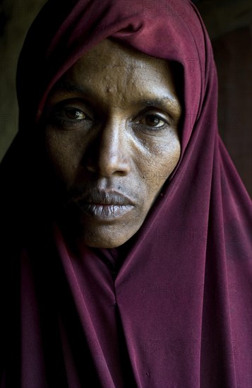 Portrait of a muslim woman whose husband drowned in the Mediterranean sea while trying to migrate to Europe. She lives in the Oromia state, Ethiopia, Africa