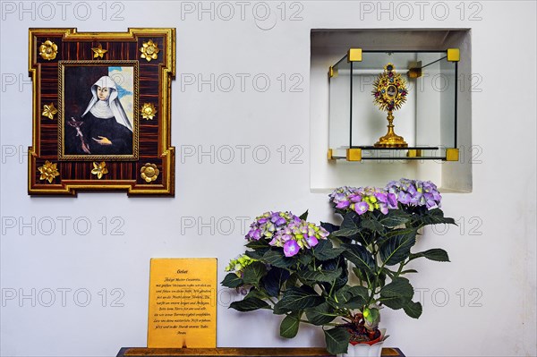 Devotional corner with picture of St. Crescentia and monstrance, former monastery church of St. Peter and Paul, Irsee monastery or abbey, former Benedictine abbey, today a conference and education centre of the Swabian district, Irsee, Swabia, Bavaria, Germany, Europe