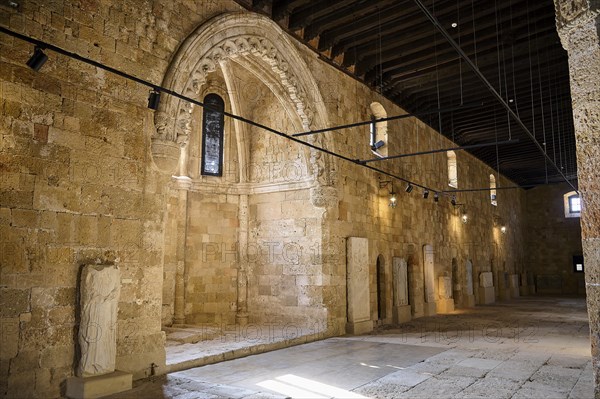 Former Great Hospital of the Order of St John, A long arcade with ornate stone walls and sculptures on display, Interior, Archaeological Museum, Old Town, Rhodes Town, Rhodes, Dodecanese, Greek Islands, Greece, Europe