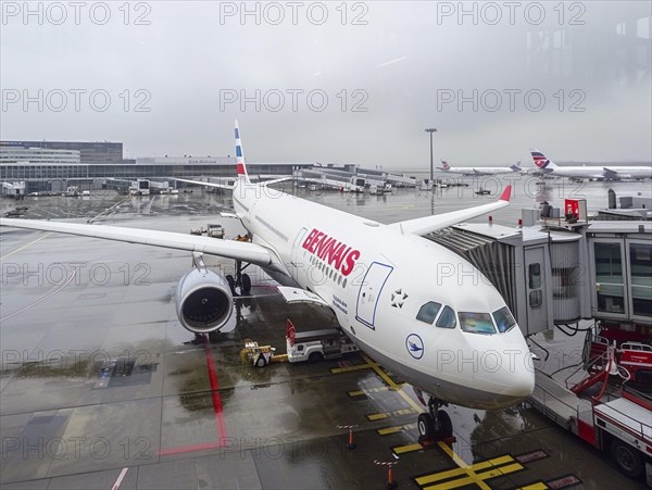 Passengers wait to board their plane at the airport, AI generated