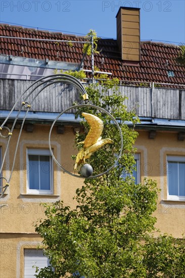 Inn sign, inn, restaurant, figure of a golden eagle, advertising sign, Hotel Adler am Schloss, nose sign, cantilever, advertising, behind house, facade, window, chimney, Boennigheim, Ludwigsburg district, Baden-Wuerttemberg, Germany, Europe