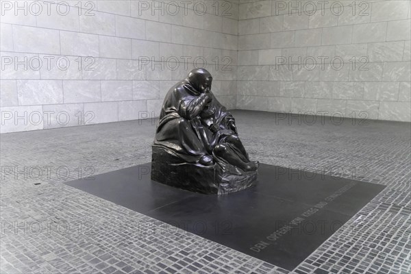 Pieta by Kaethe Kollwitz in the Schinkelbau Neue Wache unter den Linden in Berlin, Berlin, Germany, Europe, Sad sculpture of a mother with her child displayed on a grey square, Europe