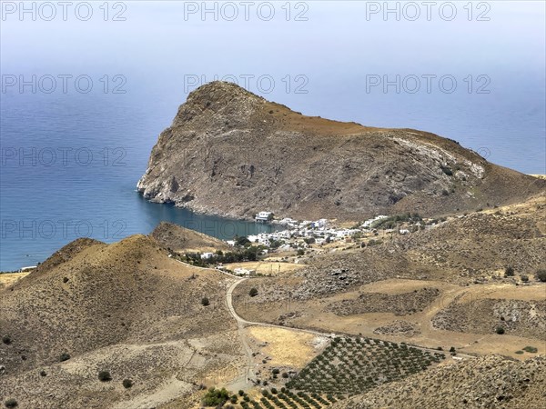 View from elevated position on small village Lentas Lendas at the foot of Asterousia Mountains next to Cape Leontas with rock called weeping lion at south coast of Crete island at Libyan Sea Mediterranean, Lentas, Crete, Greece, Europe