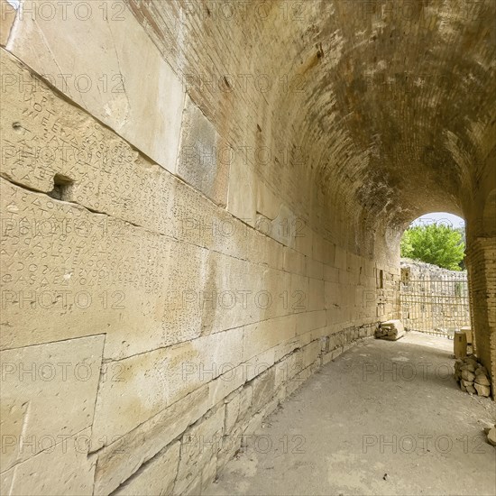 Wall of archway behind amphitheatre carved written chiselled laws City law of Gortys carved in stone Gortyn law book Large inscription, written in Doric dialect alternately from left to right and right to left, oldest discovered legal text in Europe, Gortyna, Crete, Greece, Europe