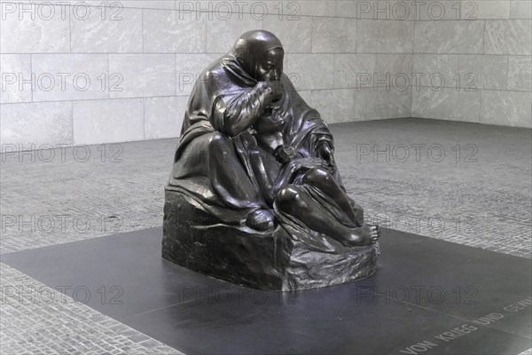 Pieta by Kaethe Kollwitz in the Schinkelbau Neue Wache unter den Linden in Berlin, Berlin, Germany, Europe, Sad sculpture of a mother with her child displayed on a grey square, Europe