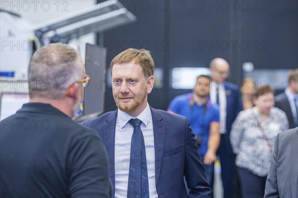 Minister President Michael Kretschmer visited TRUMPF Sachsen SE in Neukirch. After being welcomed by Dr Nicola Leibinger-Kammueller, CEO of TRUMPF SE + Co KG, and Dr Mathias Kammueller, CDO of TRUMPF SE + Co KG, the Minister-President talked to those present and took part in a tour of the company. The company is one of the international market and technology leaders in the field of machine tools and lasers for industrial production, Neukirch/Lausitz, Saxony, Germany, Europe