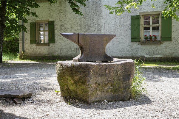 A classic anvil stands on a stone in front of a forge, Neuhausen ob Eck open-air museum, Tuttlingen district, Baden-Wuerttemberg, Germany, Europe