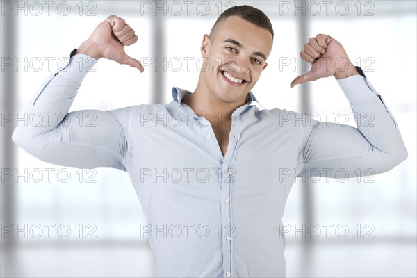 Happy man pointing at himself, isolated in white