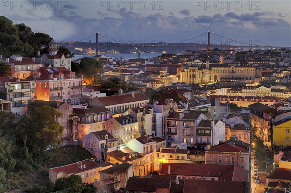 View from the viewpoint Miradouro da Graça, also Sophia de Mello Breyner Andresen, city view, old town, bridge 25 de Abril, river Tejo, Lisbon, evening mood, twilight, blue hour, Portugal, Europe