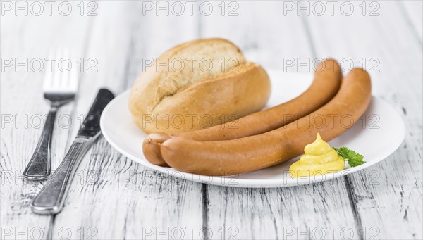 Wiener Sausages on a vintage background as detailed close-up shot (selective focus)