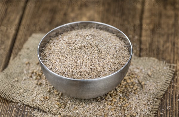 Portion of Wheat Bran as detailed close-up shot, selective focus