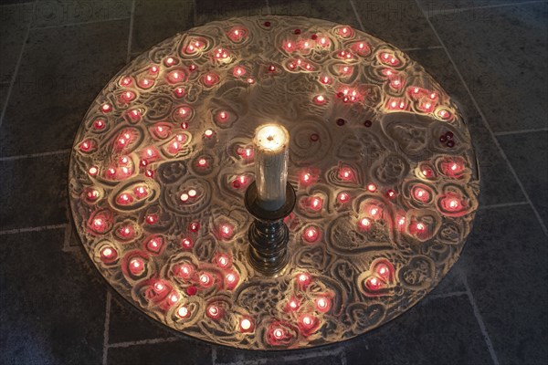 Burning devotional candles on sand in the Lorenzkirche, Nuremberg, Middle Franconia, Bavaria, Germany, Europe