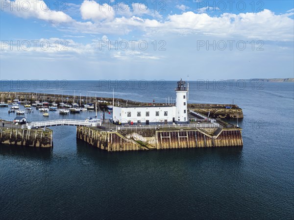 Scarborough Lighthouse and Harbour from a drone, Vincent Pier, Scarborough, North Yorkshire, England, United Kingdom, Europe