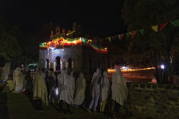 People gathering at Timkat festival at Fasilides Bath in Gondar, Ethiopia, Africa