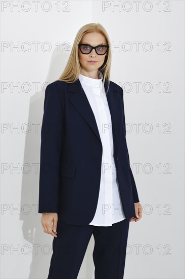 Studio portrait of self-assured business woman on white background