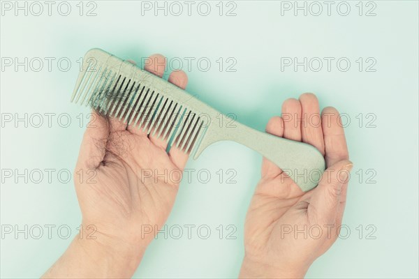 Comb with hair loss, health problem, issue of aging, alopecia areata by stress or infection, hairbrush