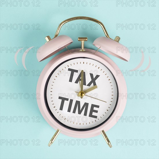 Tax time, alarm clock for taxation, deadline for payment, financial income