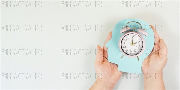 Head with alarm clock, time pressure and management in business, having a deadline or appointment, efficiency planning