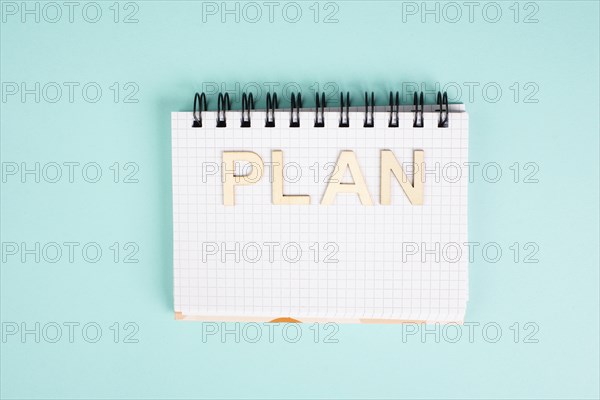 Plan is standing in a notebook, planning new goals, to do list, new year resolutions